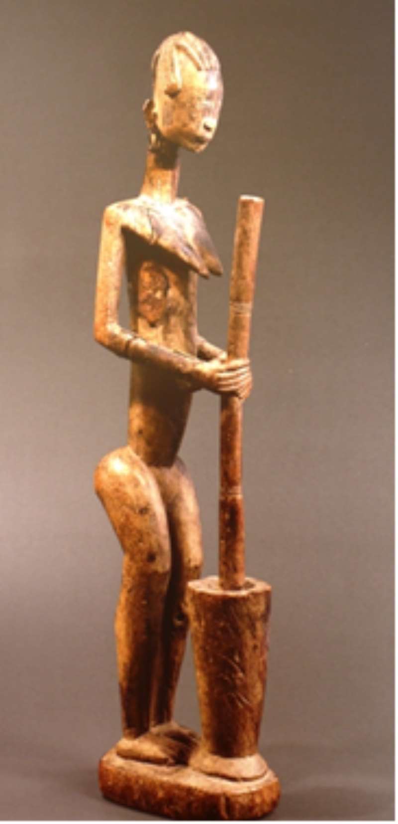 WOMAN POUNDING MILLET, BANDIAGARA, MALI, NOW IN A PRIVATE COLLECTION, PARIS, FRANCE.