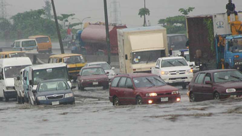 Vehicles wade through the flooded Apapa-Oshodi expressway from Sanya Bus Stop to Mile 2, yesterday. The 5-minute journey now takes over three hours. Photo: Bunmi Azeez. 