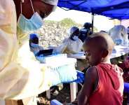 A healthcare worker administers a vaccine to a child in the city of Goma on 17 July 2019, during a previous Ebola outbreak in the Democratic Republic of Congo. - REUTERS/Olivia Acland