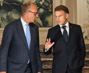 French President Emmanuel Macron and German Chancellor Friedrich Merz arrive for a joint press conference at Augustusburg castle in Bruehl, Germany, on July 17, 2026. - Ina Fassbender, AFP