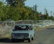 A file image of a car along a street with installed razor wire in the city of Kramatorsk, Donetsk region, Ukraine, September 9, 2026. - Serhii Korovainyi, Reuters