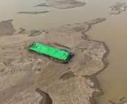 A file image of a barge stranded on the dry riverbed of the Kapuas River in Sekadau, West Kalimantan, Indonesia, on September 11, 2026. - Tatan Syuflana, AP