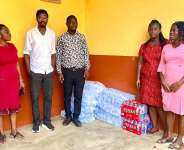 Leon Daniel Agyeman Dodoo in a group photograph with some teachers of the school.
