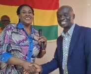 Prof. Agyemang in a handshake with Ghana High Commission, Mrs. Odunton