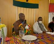 Nana Kota Ntiamoah (with microphone dressed in cloth) speaking during the inauguration of the NUGN in Bergen. Seated with him are the Ghanas Ambassador to Norway, Jennifer Lartey and her team from the Ghana Embassy, Oslo