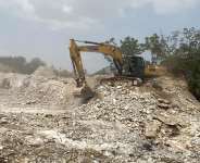 An excavator digs into the gravel at Omanjor Quarry site Photo Credit Afia Agyapomaa Ofosu