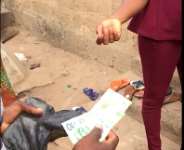 Amewus men dole out new cedi notes to voters prior to the elections