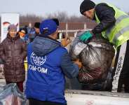 IOM staff loading winter assistance in the Kyrgyz capital Bishkek for transport to remote border communities where thousands of people are still displaced by last September’s armed clashes. Photo: IOM/Kanat Sharipbekov and Adilet Abdyrasul uulu.