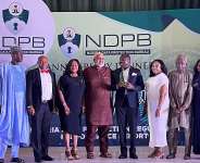 Nigeria Digital ID4D project Coordinator, Odole Solomon (4th R) and other project team members posing for a photograph with the Chairman, African Union Cybersecurity Expert Group, Mr. Abdulhakeem Ajijola (4th L)after receiving the Award