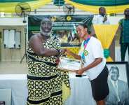 A student of Kibi PCoE receiving an award from Mawerehene of Akyem Abuakwa traditional area, Barima Yaw Oppong Krodie