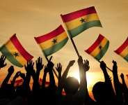 People holding the flag of Ghana.