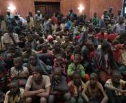 Students gather at the Government House with other students from the Government Science Secondary school, in Kankara, in northwestern Katsina State, Nigeria following their release on Dec. 18, 2020. (AFP Photo)