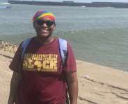 LaSonya at the beach of Jamestown. The pier in the back is the point of no return for the Africans of the small fishing town.