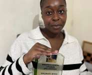 Patience Ochere with her moga awards