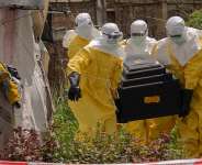 A woman cries as Red Cross workers carry the coffin of a person who died of Ebola from a health centre in Rwampara, Congo, May 20, 2026. -  Moses Sawasawa, AP