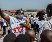 A Red Cross volunteer speaks to people during a public awareness campaign in Bunia, DRC, where the current outbreak began on 15 May. -  AP Photo / Moses Sawasawa