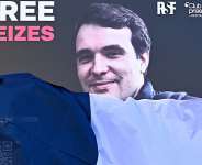 A portrait of French journalist Christophe Gleizes, who is detained in Algeria, is unveiled during a demonstration organised by the Occitanie Press Club and rights group Reporters Without Borders (RSF) to demand his release in Montpellier, southern France on 29 January 2026. - AFP - GABRIEL BOUYS