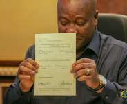 President Mahama signing bills into law