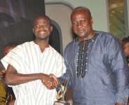 File Photo: Manasseh with President John Mahama when he received the National Youth Achievers’ Award for Media Excellence in 2012