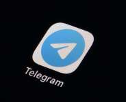 The icon for the instant messaging Telegram app is seen on a smartphone, Tuesday, Feb. 28, 2023. -  Matt Slocum, AP