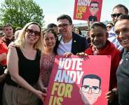 Andy Burnham, centre, is bidding to return to parliament after a nine-year absence. - Paul ELLIS / AFP
