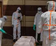 Health workers prepare the coffin of a university student who died of Ebola at the Citadelle Clinic in Bunia on June 12, 2026. -  Moses Sawasawa, AP