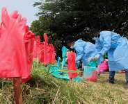 Medical workers in protective equipment wash their hands at an Ebola treatment centre at the Rwambara General Reference Hospital in Bunia, eastern DRC, 16 June 2026. -  REUTERS - Gradel Muyisa Mumbere