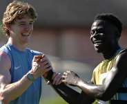 Getty ImagesImage caption: Bukayo Saka (right) trained with the England squad on Sunday
