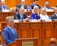 Prime Minister-designate Adrian Vestea addresses parliament during a vote to confirm his new government in Bucharest on June 22, 2026. -  Mihai Barbu, AFP