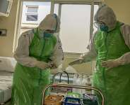 Two nurses in their Personal Protection Equipment (PPE) prepare to receive a patient with a highly infectious disease such as Ebola, during a simulation exercise at the special isolation ward of the department of Infectious Diseases Unit (IDU) at the the Kenyatta National hospital in Nairobi on 12 June, 2026. - AFP - SIMON MAINA