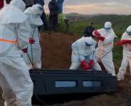 Health workers carry out a so-called EDS, a “safe and dignified burial” of an Ebola victim in Bunia, in June 2026. -  Bndiction Murhabazi