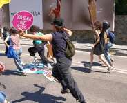 People run from the police during a march in support of transgender people and their rights during the LGBTQ Pride week in Istanbul, Turkey, Sunday, June 21, 2026. The placard reads in colloquial Turkish: Whats forbidden. Come on!. -  Dilara Acikgoz, AP