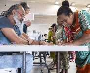 People vote at the Veyret-Kafoa polling station during New Caledonias provincial elections in the Riviere Salee neighbourhood of Noumea, New Caledonia, on 28 June 2026. - AFP - DELPHINE MAYEUR