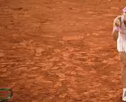 Mirra Andreeva celebrates after beating Marta Kostyuk. - Julien De Rosa, AFP