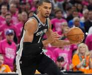 San Antonio Spurs forward Victor Wembanyama (1) drives against the New York Knicks during the first half of Game 1 of the NBA Finals basketball series, Wednesday, June 3, 2026, in San Antonio - Eric Gay, AP