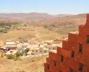 The burial place of the venerated Rabbi David-ou-Moshe as seen from the entryway to the adjacent hilltop fruit tree nursery. Imerdal, Morocco. July 2021. Photo: Katie Bercegeay/High Atlas Foundation