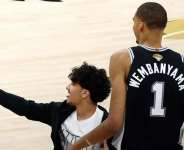 Getty ImagesImage caption: The court invader will be banned from all NBA arenas for life