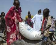 Maize being collected at the Bentiu displaced persons camp in South Sudan. - Rian Cope, AFP