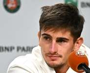Getty ImagesImage caption: Matteo Arnaldi looked peaky when he talked to the media about pulling out of the French Open