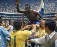 Brazil striker Pel, the only player to win the World Cup three times, was held aloft by teammates after inspiring Brazil to a 4-1 win over Italy in the 1970 World Cup final at the Estadio Azteca in Mexico City. - AP