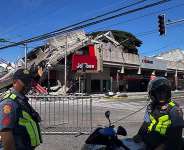Buildings including a Jolibee restaurant collapsed following a 7.8-magnitude earthquake that hit off Mindanao island. -  Edwin Espejo, AFP