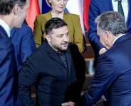 FILE - Ukraines President Volodymyr Zelensky and U.S. Special Envoy Steve Witkoff talk to each other as Jared Kushner, the son-in-law of U.S. President Donald Trump, and European Commission President Ursula von der Leyen look on. -  Kay Nietfeld, Reuters