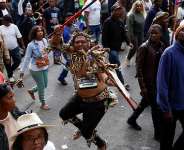 Anti-immigration protesters march through Durban, South Africa, on 30 June 2026, with one demonstrator wearing traditional Zulu attire and carrying a spear as campaign groups marked their unofficial deadline for undocumented migrants to leave the country. - Rogan Ward / Reuters