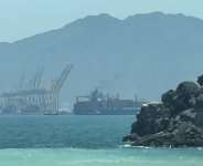Image from an AFPTV video dated July 12, 2026, showing a ship near the Strait of Hormuz, off the eastern coast of the United Arab Emirates, at Khor Fakkan -  AFP