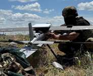 File photo: A serviceman prepares to launch a Hornet middle strike drone towards Russian troops from a position near a front line in Donetsk region on June 23, 2026. -  Stringer, Reuters