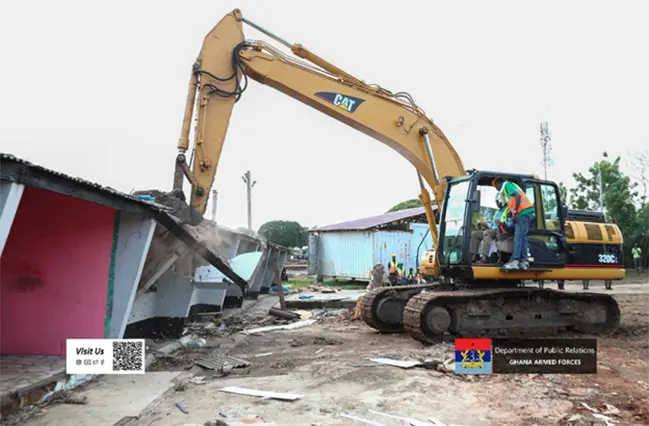 Ernest Brogya Genfi demolishing one of the old Burma Camp structures