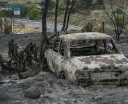A wildfire that has killed at least 12 people in southern Spain was close to being brought under control, allowing hundreds of evacuated residents to return home. -  Jose Jordan, AFP