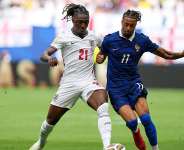 Englands Eberechi Eze (21) and Frances Michael Olise (11) battle for the ball during the World Cup third-place playoff soccer match between France and England in Miami Gardens, Fla., Saturday, July 18, 2026. -  Rebecca Blackwell, AP