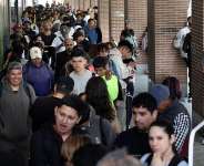 Streams of men, women and children have queued in the streets to obtain documents and attend appointments for their regularisation. -  Thomas Coex, AFP