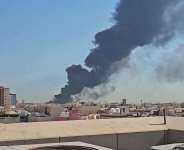 This screen grab of video footage posted on social media on 18 July shows a plume of black smoke billowing over the town of Mangaf, south of Kuwait City. -  AFP